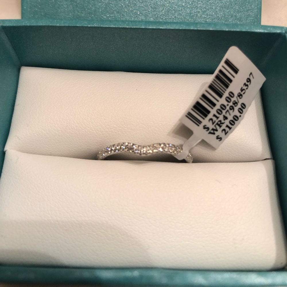 18k white gold .34 carat diamond band. Brand new.